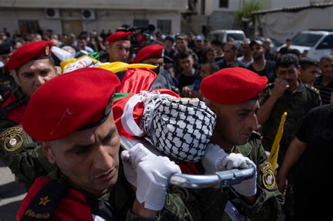 Army fire kills a 14-year-old Palestinian boy as an Israeli minister visits a flashpoint holy site